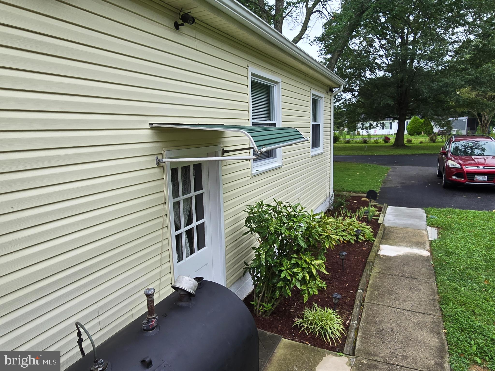 2414 Willoughby Beach Road Edgewood, MD 21040 - Photo 6 of 35 a front view of a house with garden