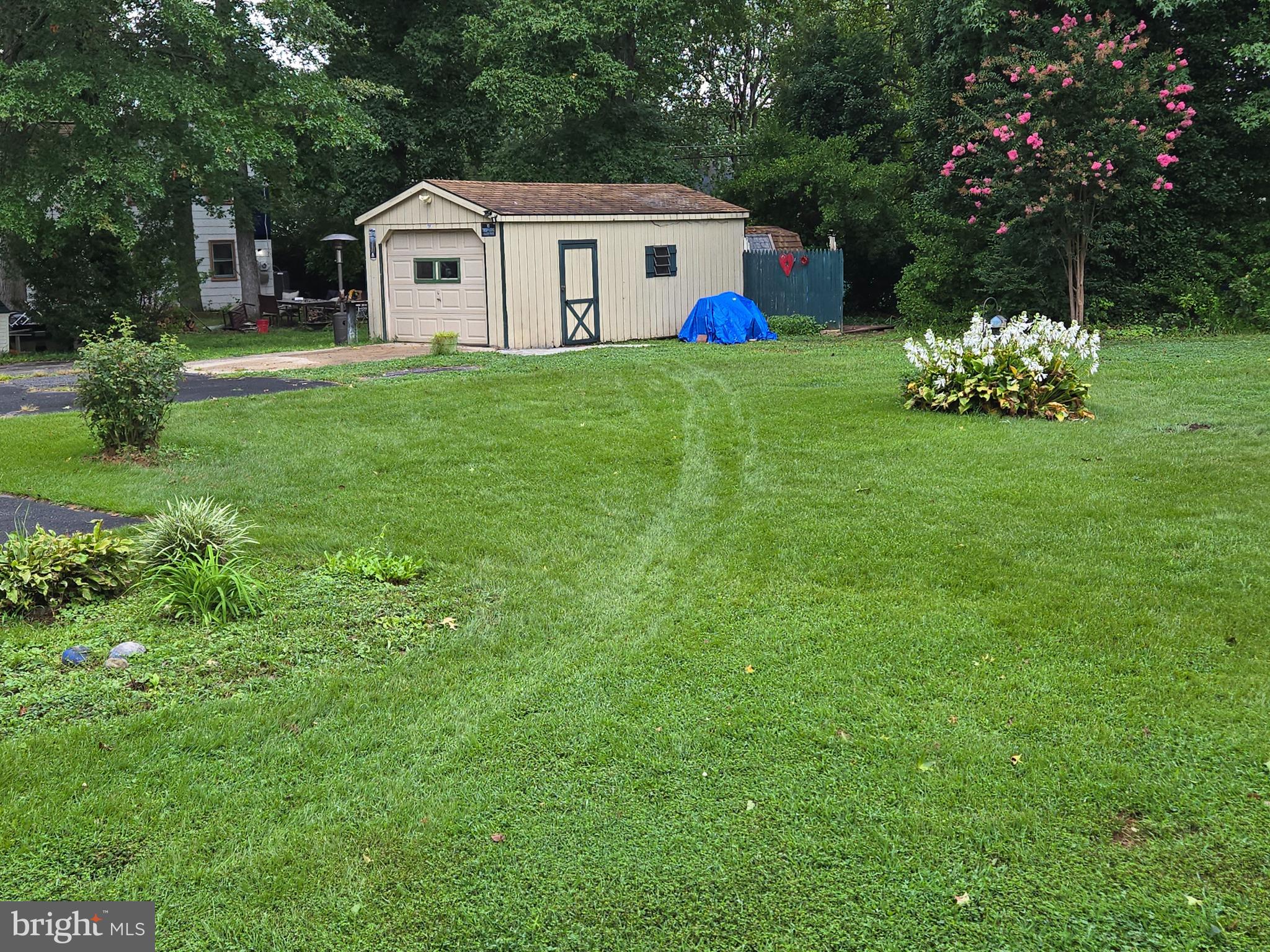 2414 Willoughby Beach Road Edgewood, MD 21040 - Photo 7 of 35 a white house with a big yard and large trees