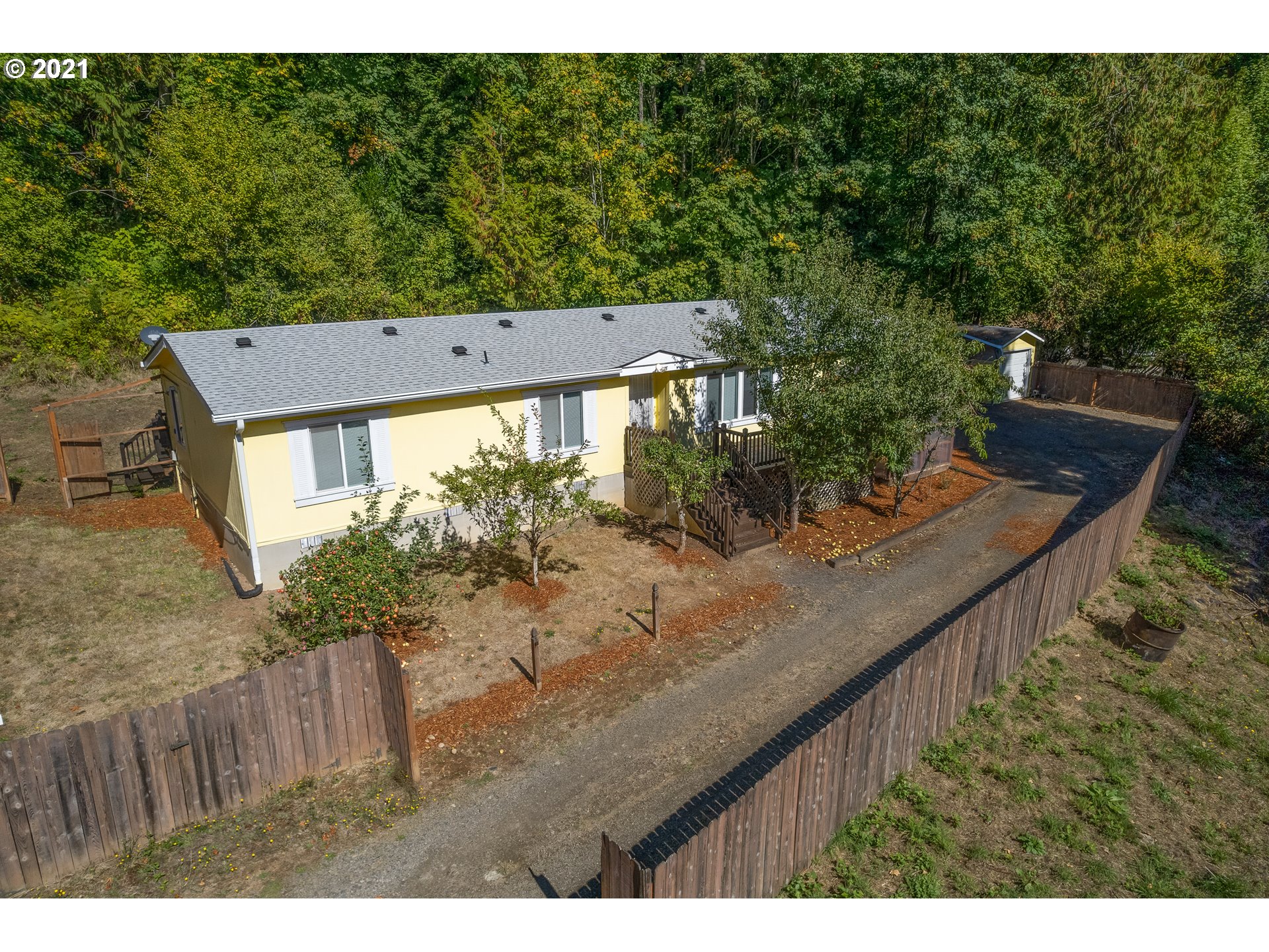 75367 Fern Hill Road Rainier, OR 97048 - Photo 1 of 27 a view of a backyard with a garden
