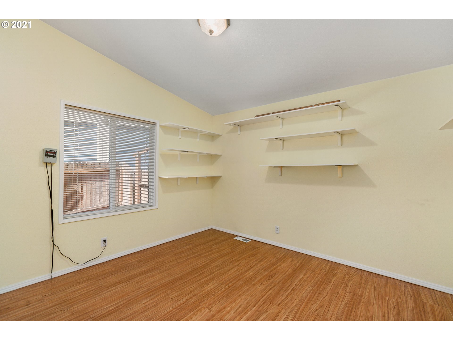 75367 Fern Hill Road Rainier, OR 97048 - Photo 19 of 27 a view of empty room with wooden floor and cabinet