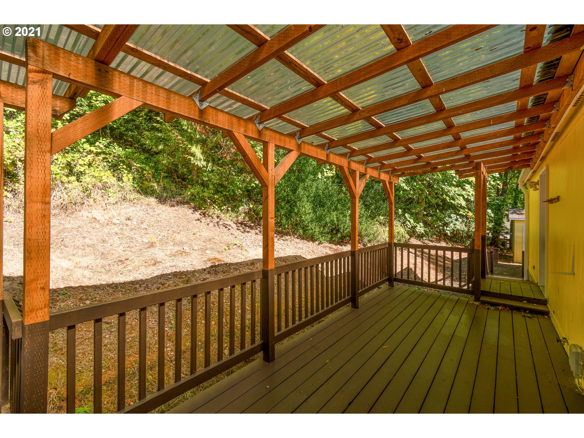 75367 Fern Hill Road Rainier, OR 97048 - Photo 24 of 27 a balcony with wooden floor in outdoor space