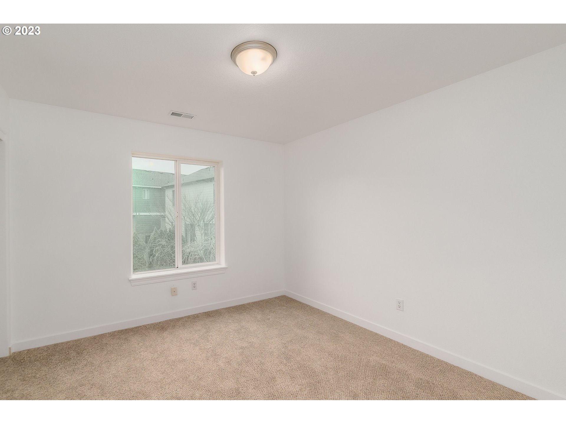 16506 Northeast 14th Avenue Ridgefield, WA 98642 - Photo 20 of 24 a view of an empty room with a window