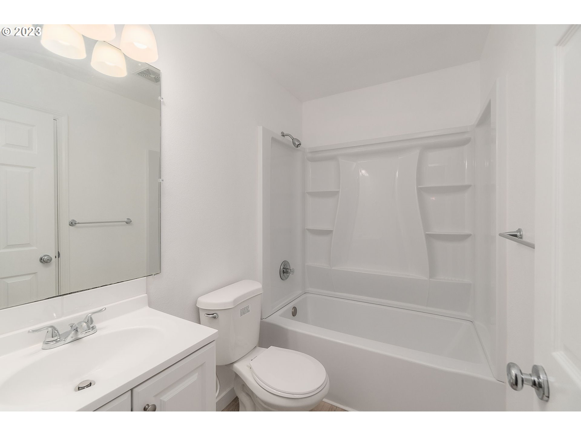 16506 Northeast 14th Avenue Ridgefield, WA 98642 - Photo 22 of 24 a bathroom with a bathtub shower sink vanity and a toilet