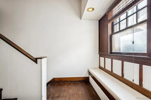 a view of a balcony with furniture