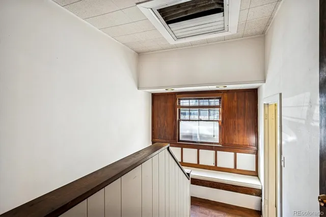 an empty room with closet and a bathroom