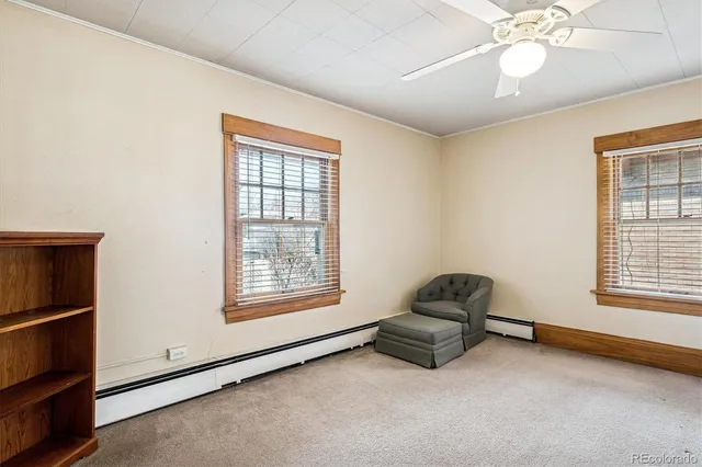 a kitchen with stainless steel appliances a refrigerator sink and white cabinets