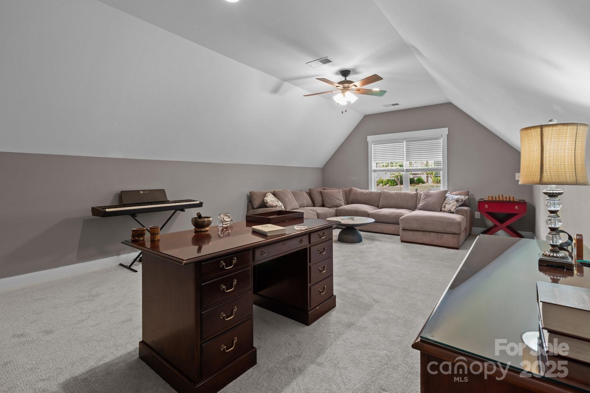 6743 Fox Ridge Circle Davidson, NC 28036 - Photo 33 of 48 a view of a livingroom with furniture and chandelier