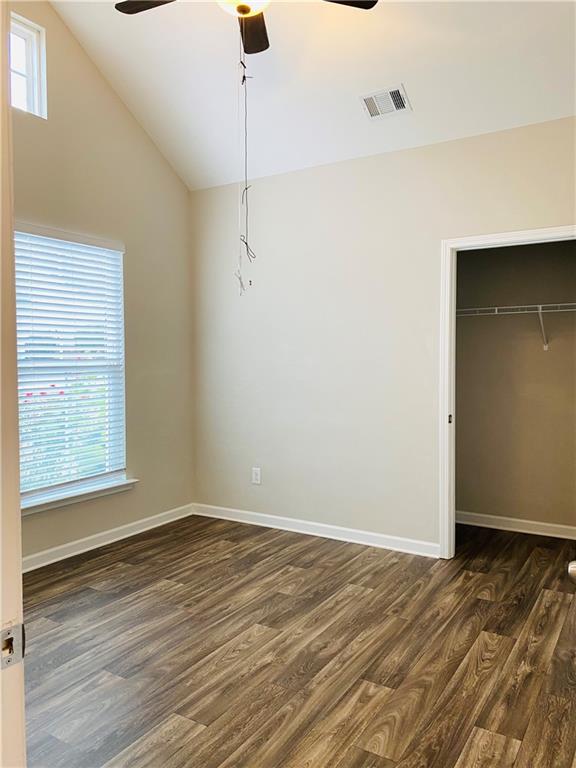 66 Wisteria Way Winder, GA 30680 - Photo 11 of 34 a view of an empty room with wooden floor and a window