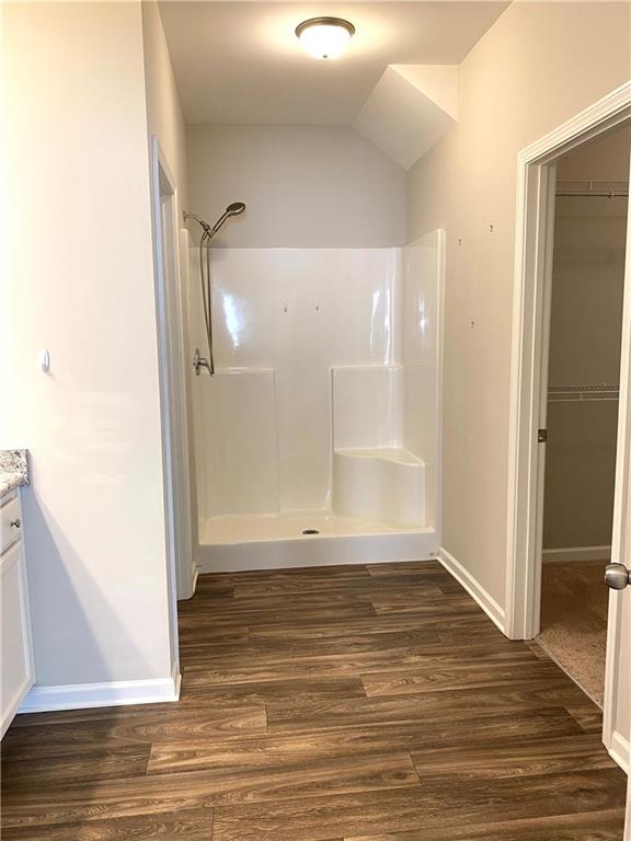 66 Wisteria Way Winder, GA 30680 - Photo 15 of 34 an empty room with wooden floor and entrance