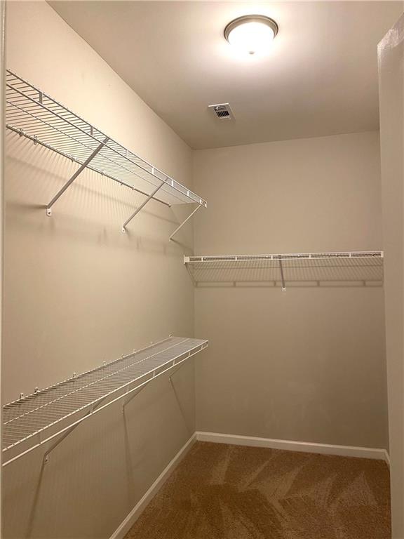 66 Wisteria Way Winder, GA 30680 - Photo 16 of 34 a view of a room with racks on the wall