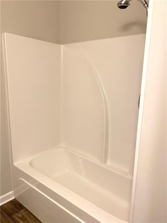 66 Wisteria Way Winder, GA 30680 - Photo 19 of 34 a close up of a bathtub in a bathroom