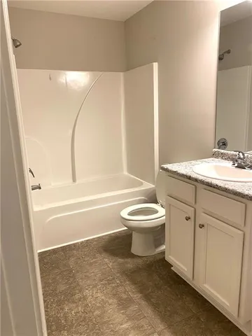 a bathroom with a toilet sink and bathtub