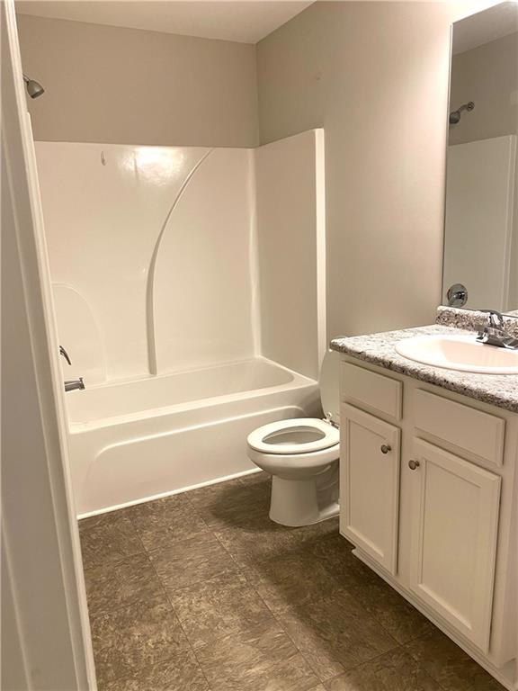 66 Wisteria Way Winder, GA 30680 - Photo 20 of 34 a bathroom with a toilet sink and bathtub