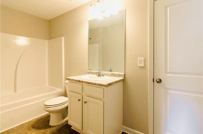 66 Wisteria Way Winder, GA 30680 - Photo 26 of 34 a bathroom with a sink toilet and shower