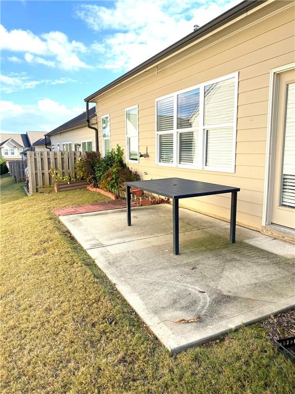 66 Wisteria Way Winder, GA 30680 - Photo 30 of 34 a view of house with wooden deck and outdoor seating