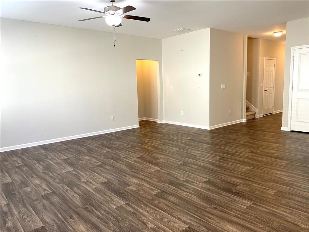 66 Wisteria Way Winder, GA 30680 - Photo 5 of 34 a view of an empty room and wooden floor