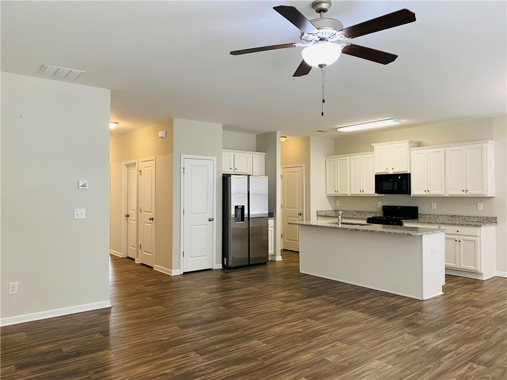 66 Wisteria Way Winder, GA 30680 - Photo 8 of 34 a view of kitchen with stainless steel appliances refrigerator stove microwave and cabinets