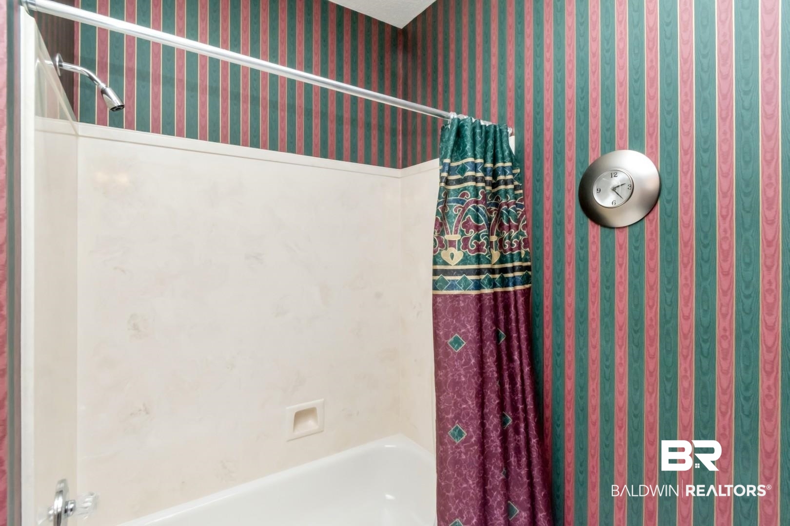 1032 Cross Gates Place Mobile, AL 36609 - Photo 21 of 34 Bathroom with wallpapered walls and shower / bath combo with shower curtain