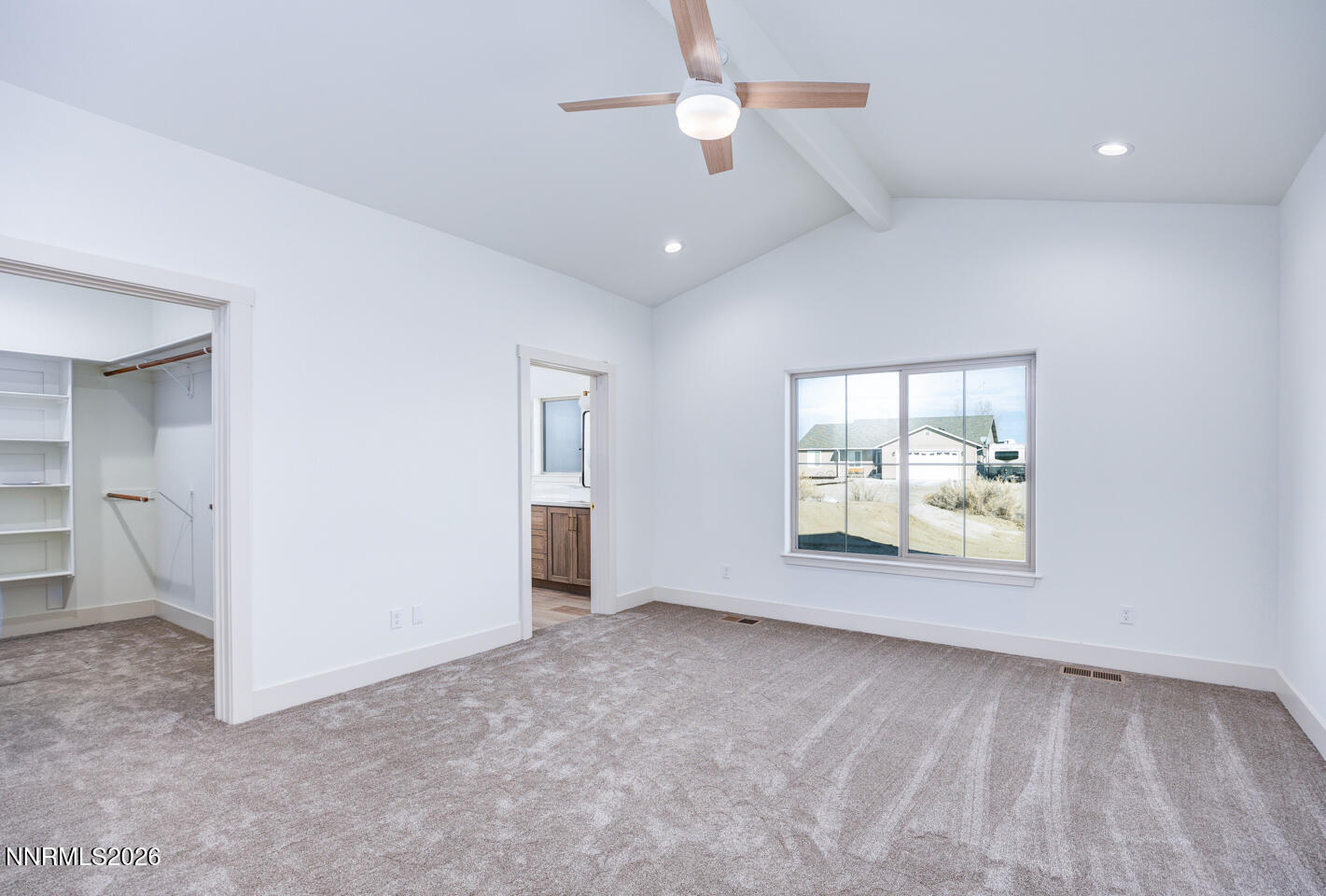 1150 Jungle Drive Fallon, NV 89406 - Photo 18 of 30 an empty room with chandelier fan and windows