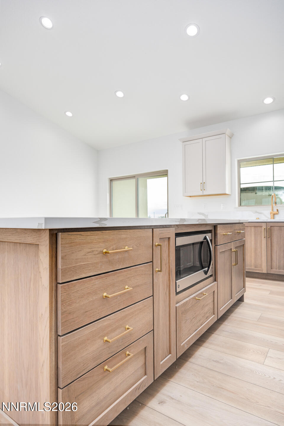 1150 Jungle Drive Fallon, NV 89406 - Photo 8 of 30 a kitchen with white cabinets and white appliances