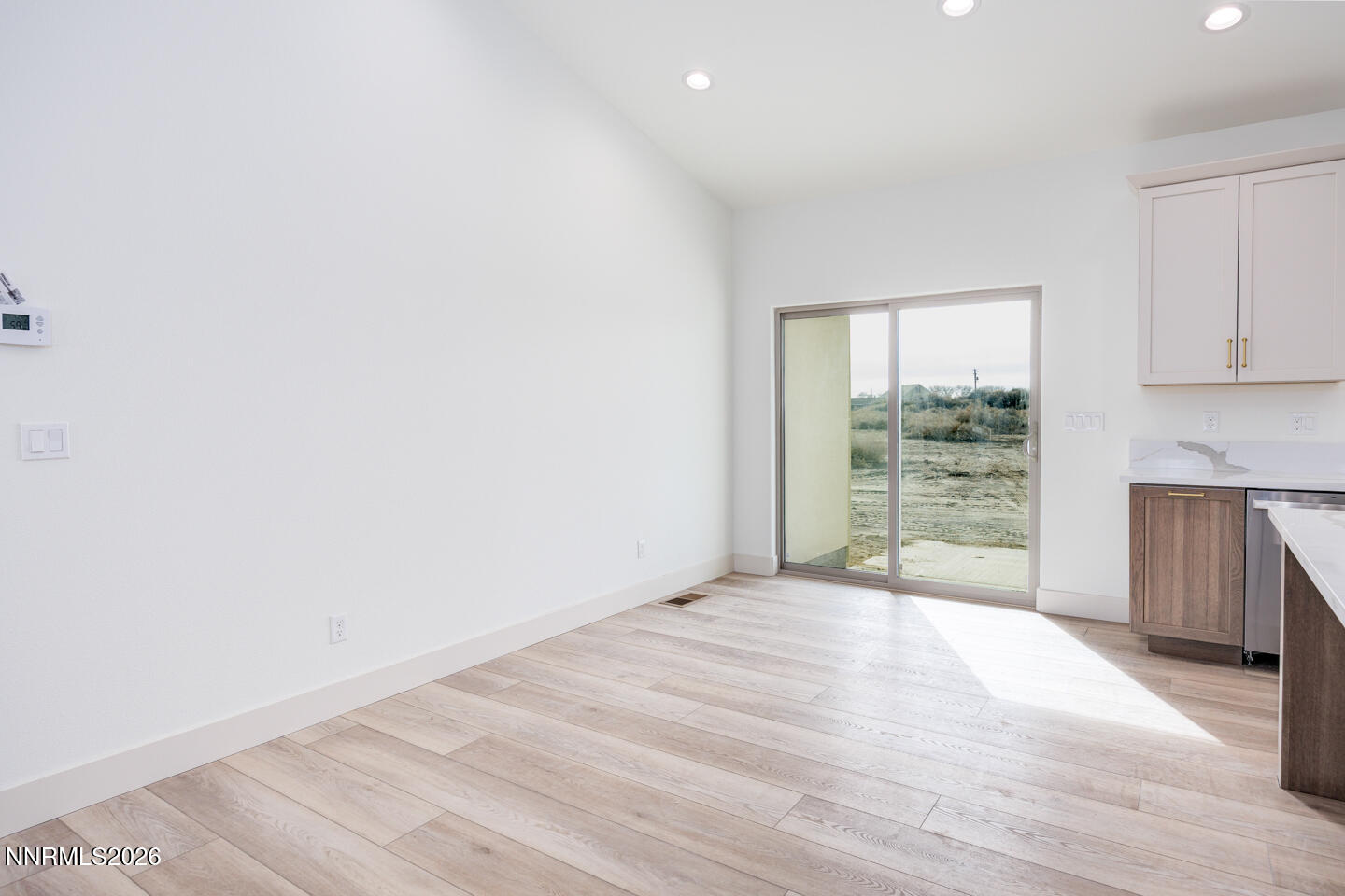 1150 Jungle Drive Fallon, NV 89406 - Photo 10 of 30 a view of an empty room with wooden floor and a window