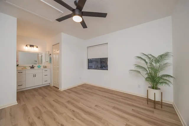 a view of swimming pool with a backyard and trees