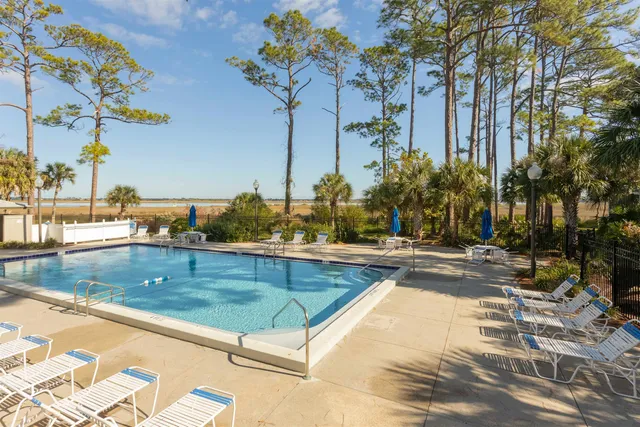 a view of a swimming pool with a lounge chairs