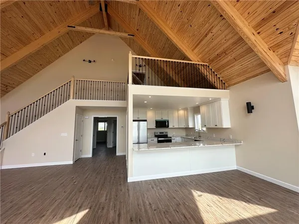 a view of a kitchen with a sink and cabinets