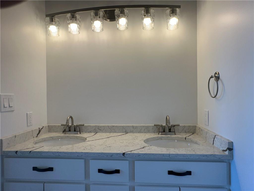 1121 Three Degree Road Butler, PA 16002 - Photo 21 of 28 a bathroom with a granite countertop sink and a mirror
