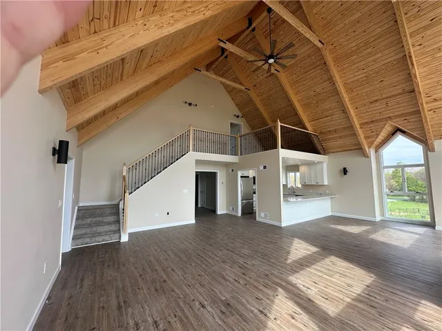 a view of a water heater room with wooden floor