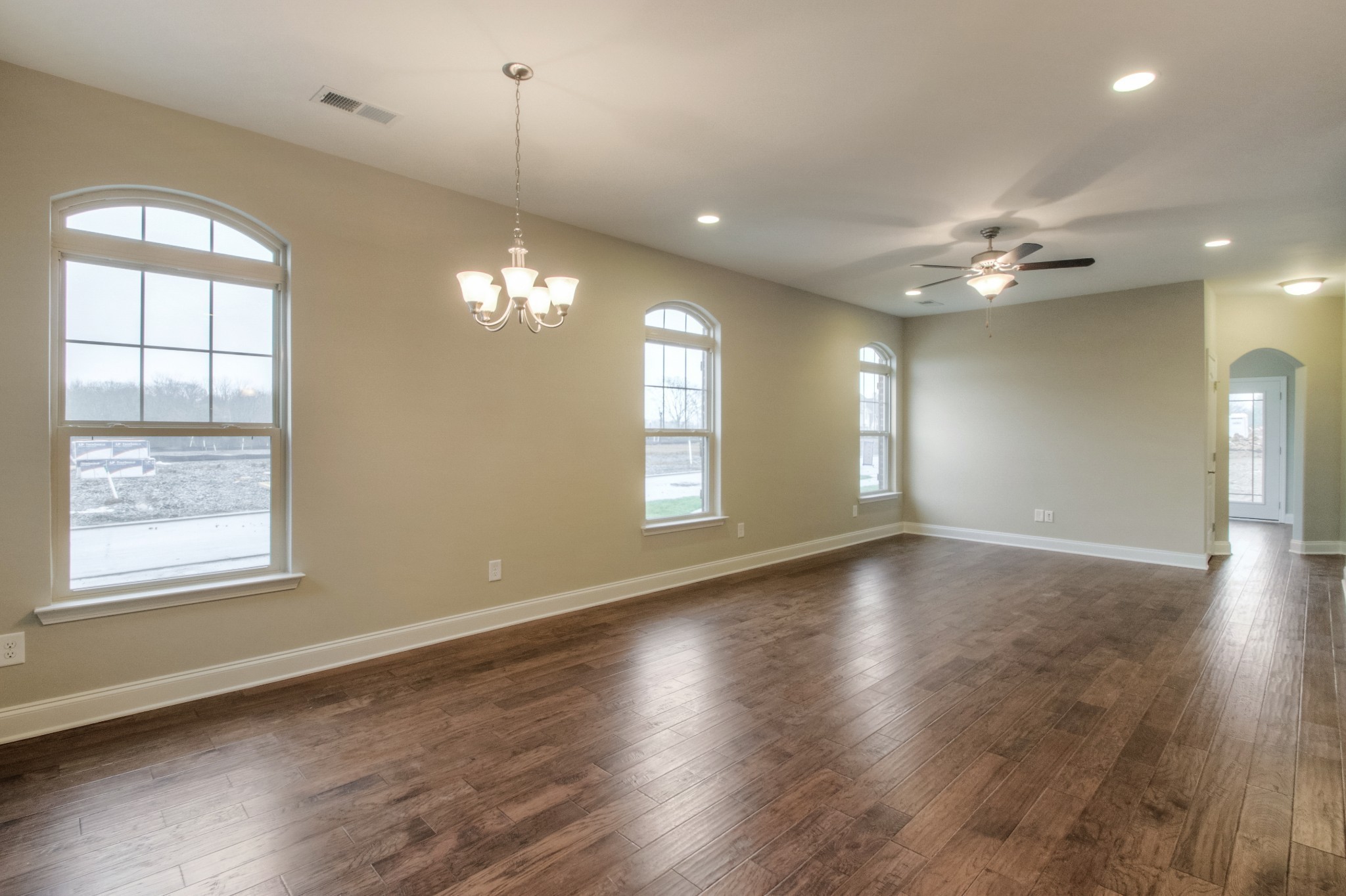 334 Buckner Cir Mount Mount Juliet, TN 37122 - Photo 3 of 40 an empty room with wooden floor and windows