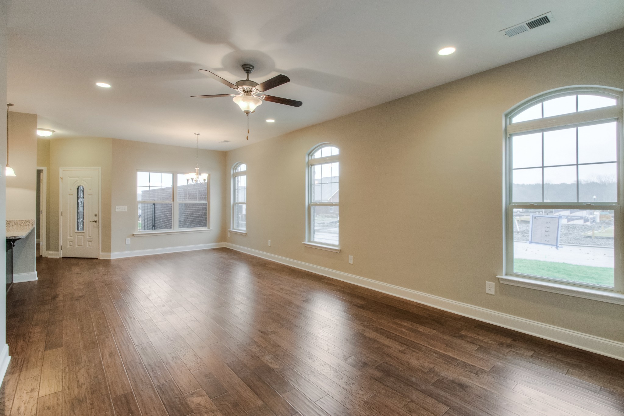 334 Buckner Cir Mount Mount Juliet, TN 37122 - Photo 6 of 40 an empty room with wooden floor and windows