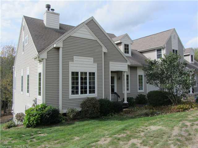 24 Mill Landing Road, Unit 24 Hebron, CT 06248 - Photo 1 of 1 a view of a white house next to a yard and plants