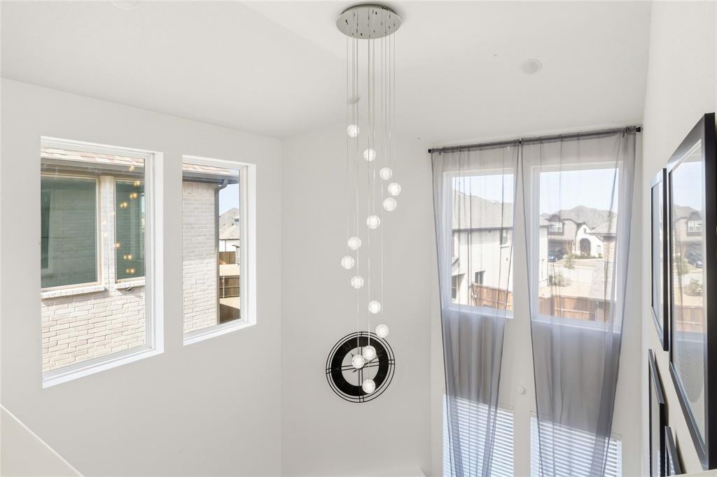 1128 Queensdown Way Forney, TX 75126 - Photo 22 of 30 Contemporary multi-globe pendant light fixture with a polished chrome ceiling plate