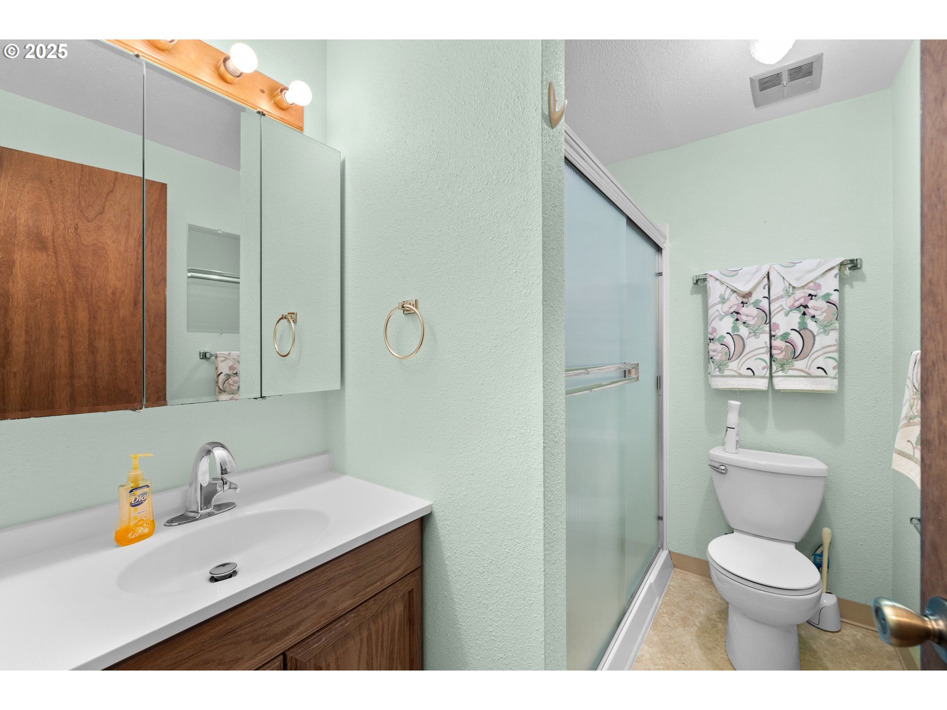 615 Cedar Street Fairview, OR 97024 - Photo 9 of 33 a bathroom with a toilet sink and mirror