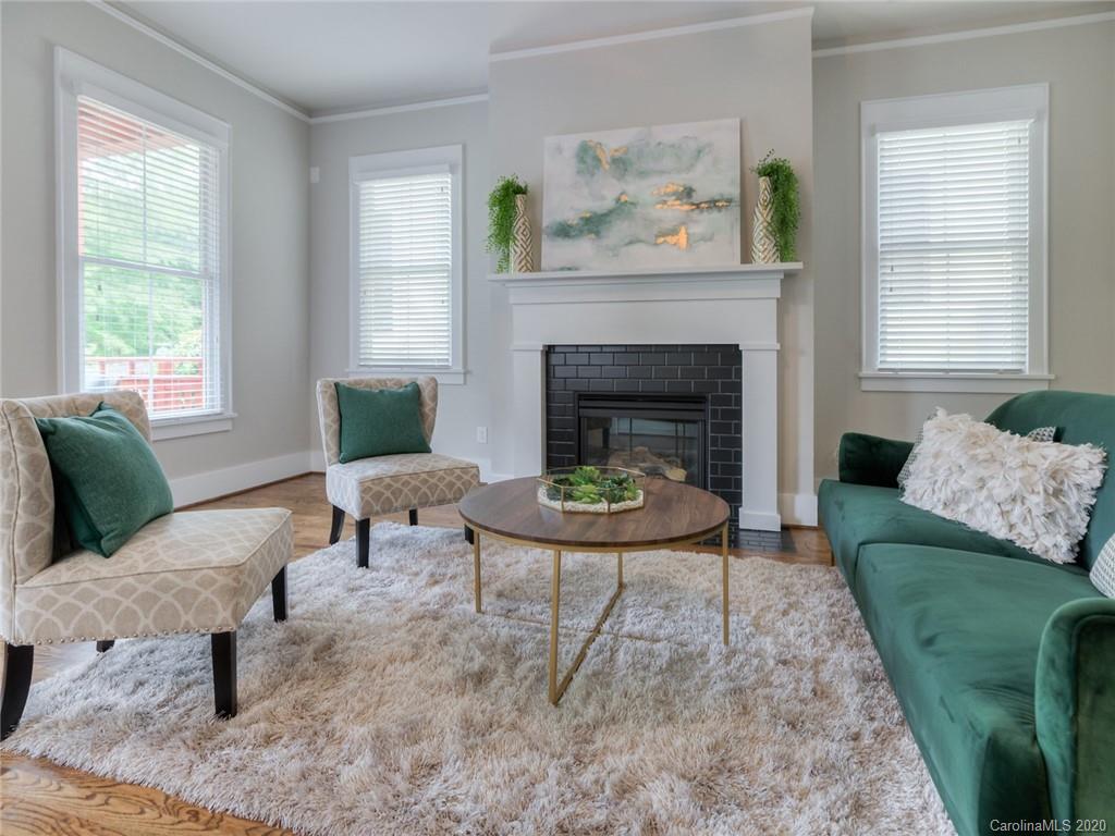209 Coneflower Place Fort Mill, SC 29708 - Photo 12 of 48 a living room with furniture and a fireplace