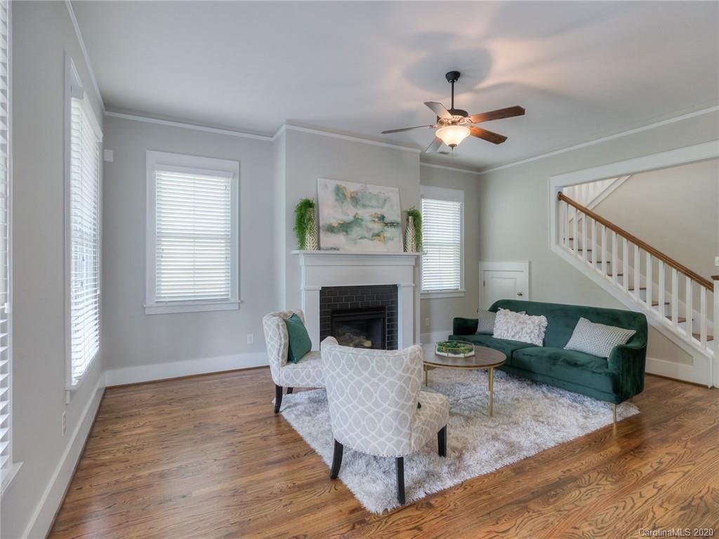 209 Coneflower Place Fort Mill, SC 29708 - Photo 13 of 48 a living room with furniture and a fireplace