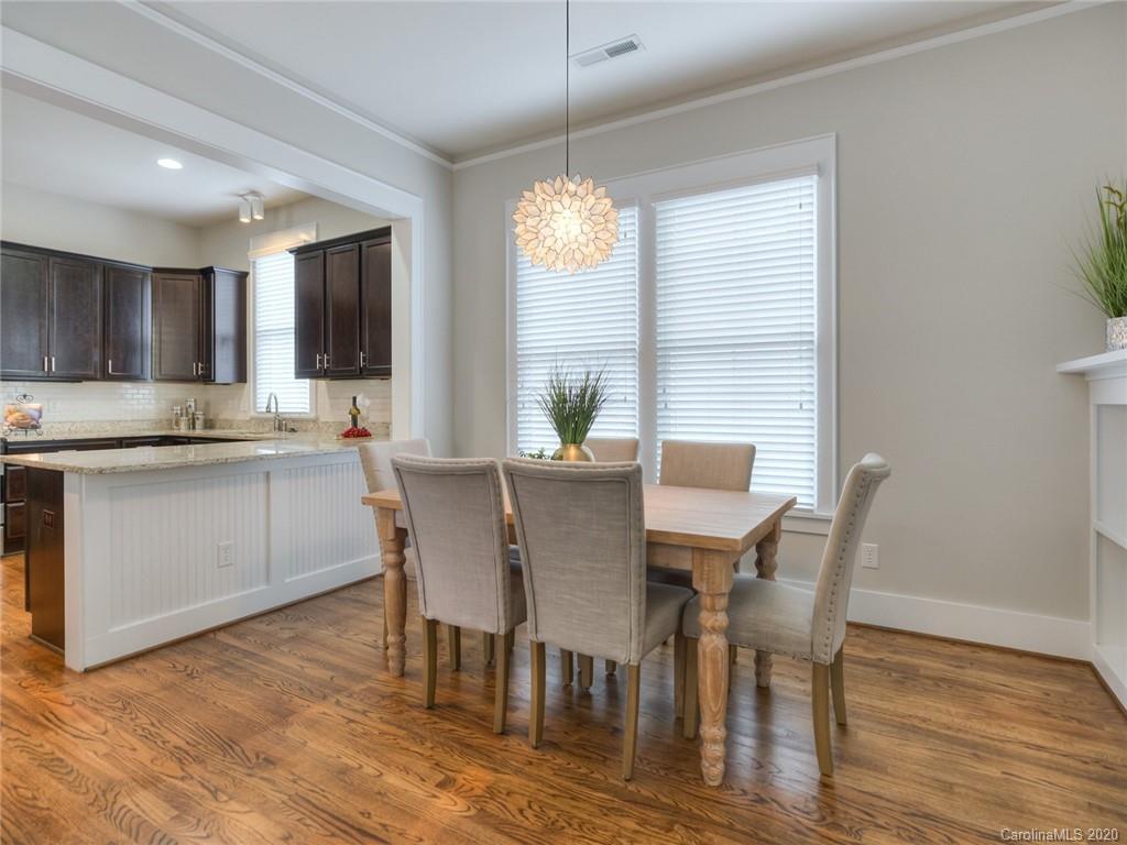 209 Coneflower Place Fort Mill, SC 29708 - Photo 14 of 48 a view of a dining room with furniture window and wooden floor