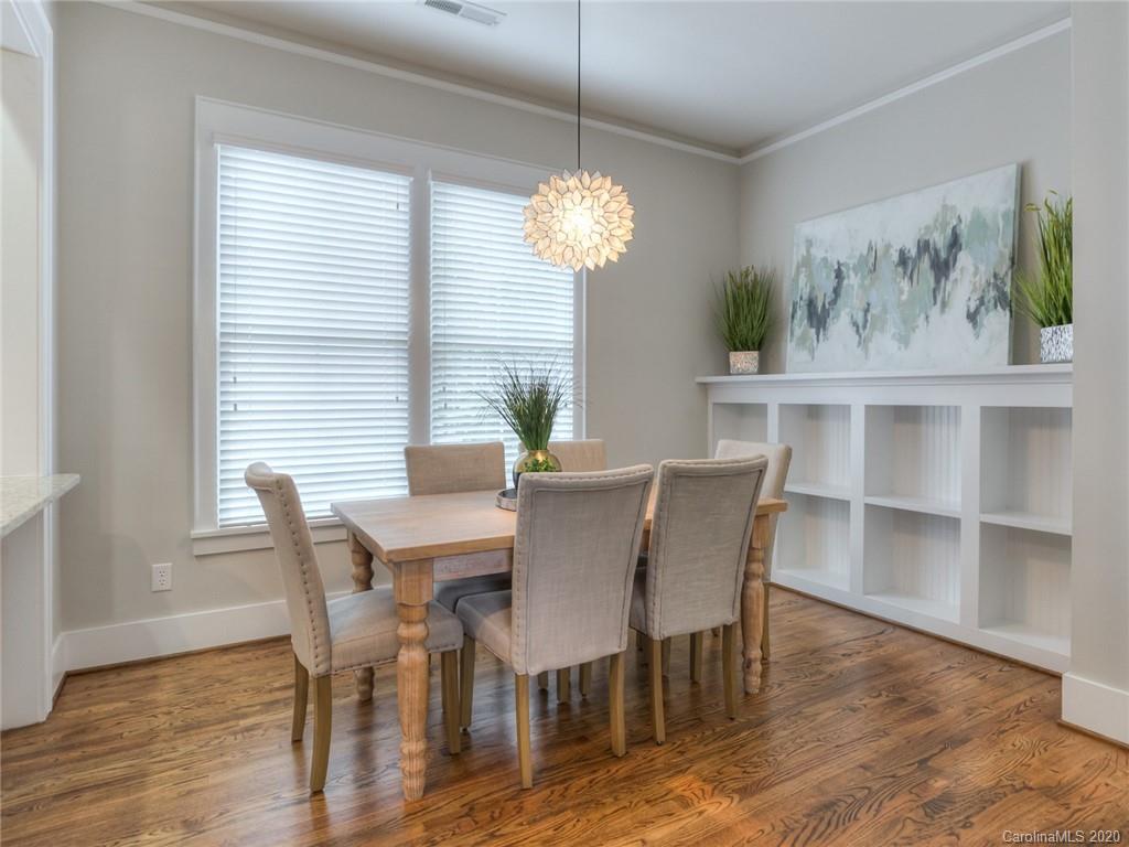 209 Coneflower Place Fort Mill, SC 29708 - Photo 15 of 48 a view of a dining room with furniture wooden floor and a window