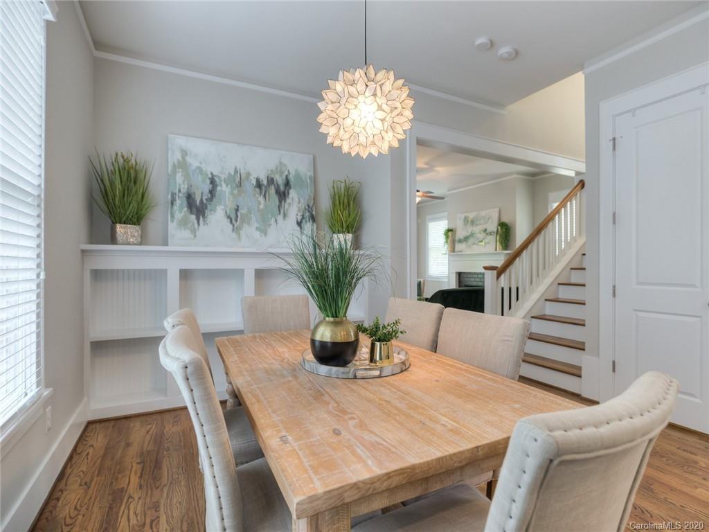 209 Coneflower Place Fort Mill, SC 29708 - Photo 16 of 48 a dining room with furniture a livingroom and chandelier