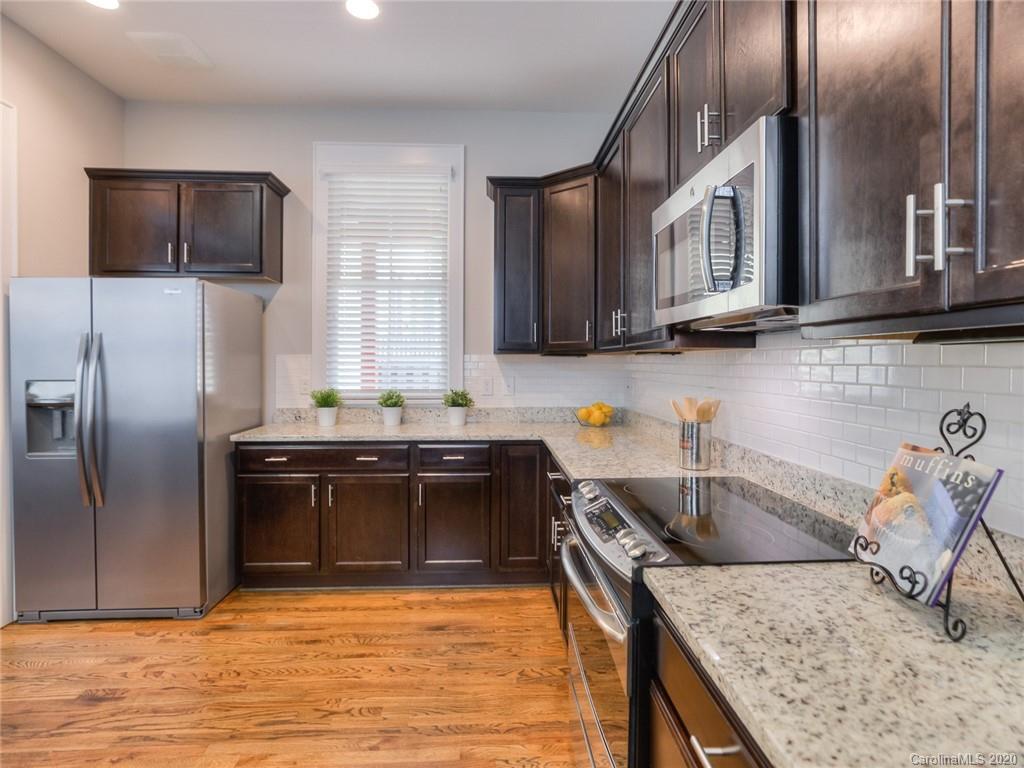 209 Coneflower Place Fort Mill, SC 29708 - Photo 22 of 48 a kitchen with a sink stove and refrigerator