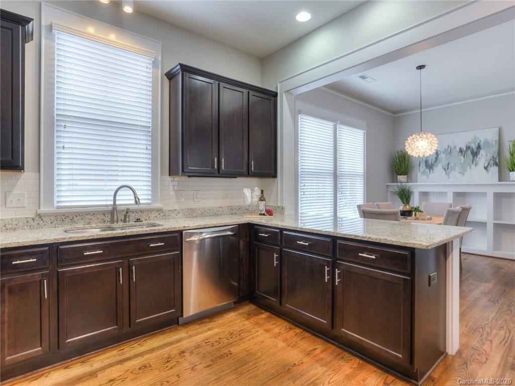 209 Coneflower Place Fort Mill, SC 29708 - Photo 23 of 48 a kitchen with a sink and cabinets