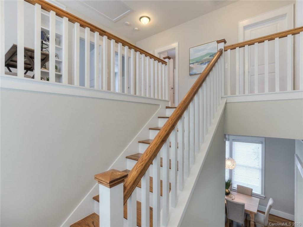 209 Coneflower Place Fort Mill, SC 29708 - Photo 27 of 48 a view of staircase with wooden floor and white walls