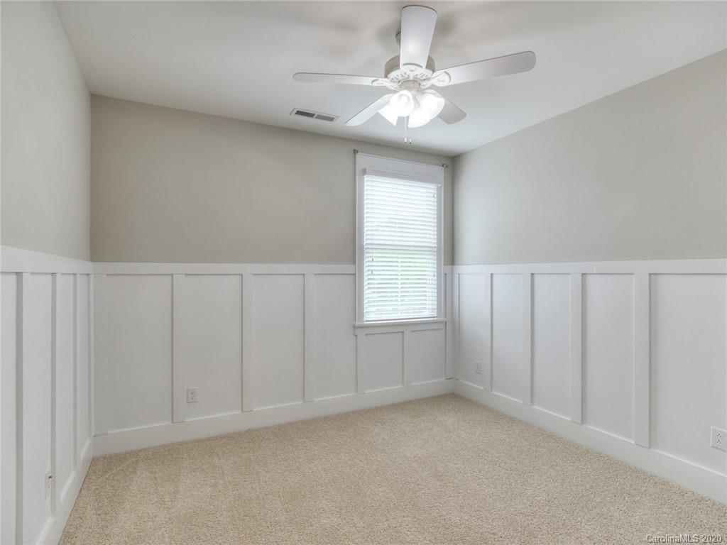209 Coneflower Place Fort Mill, SC 29708 - Photo 32 of 48 en empty room with windows and chandelier fan