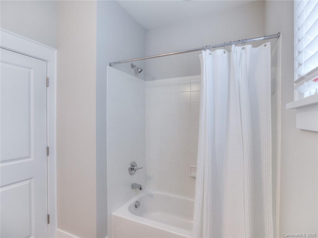209 Coneflower Place Fort Mill, SC 29708 - Photo 35 of 48 a bathroom with a shower and a bath tub