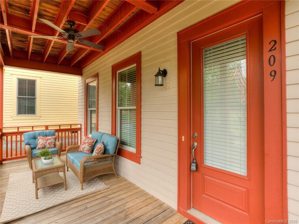 209 Coneflower Place Fort Mill, SC 29708 - Photo 5 of 48 a balcony with furniture and wooden floor
