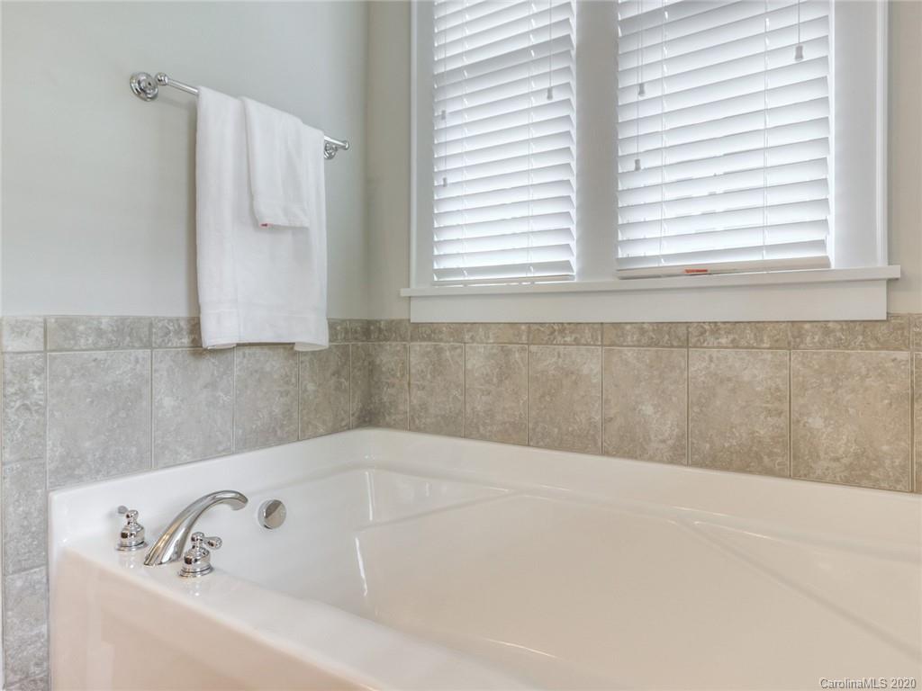 209 Coneflower Place Fort Mill, SC 29708 - Photo 42 of 48 a bathroom with a bathtub and window