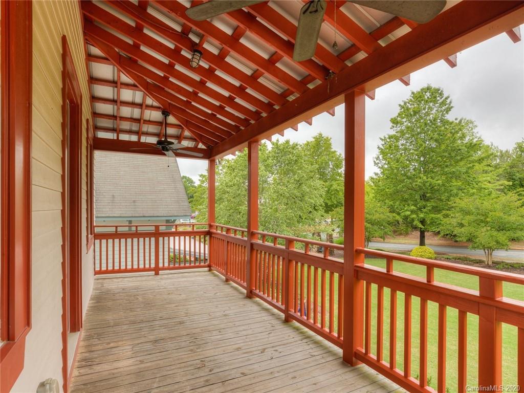 209 Coneflower Place Fort Mill, SC 29708 - Photo 44 of 48 a view of a porch with wooden floor in front of a house