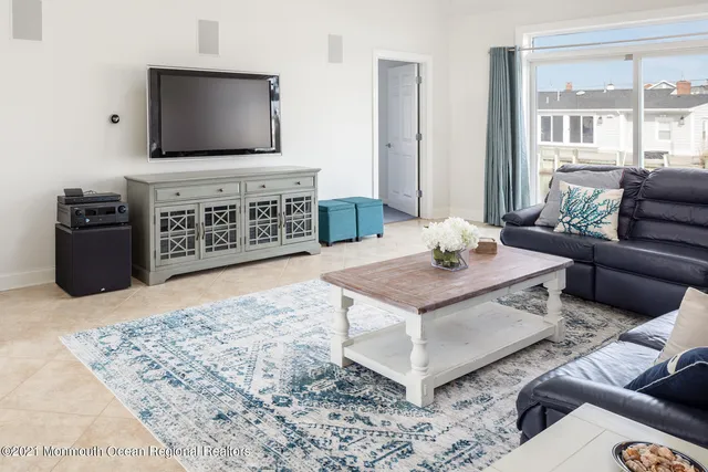 a living room with furniture wooden floor and window