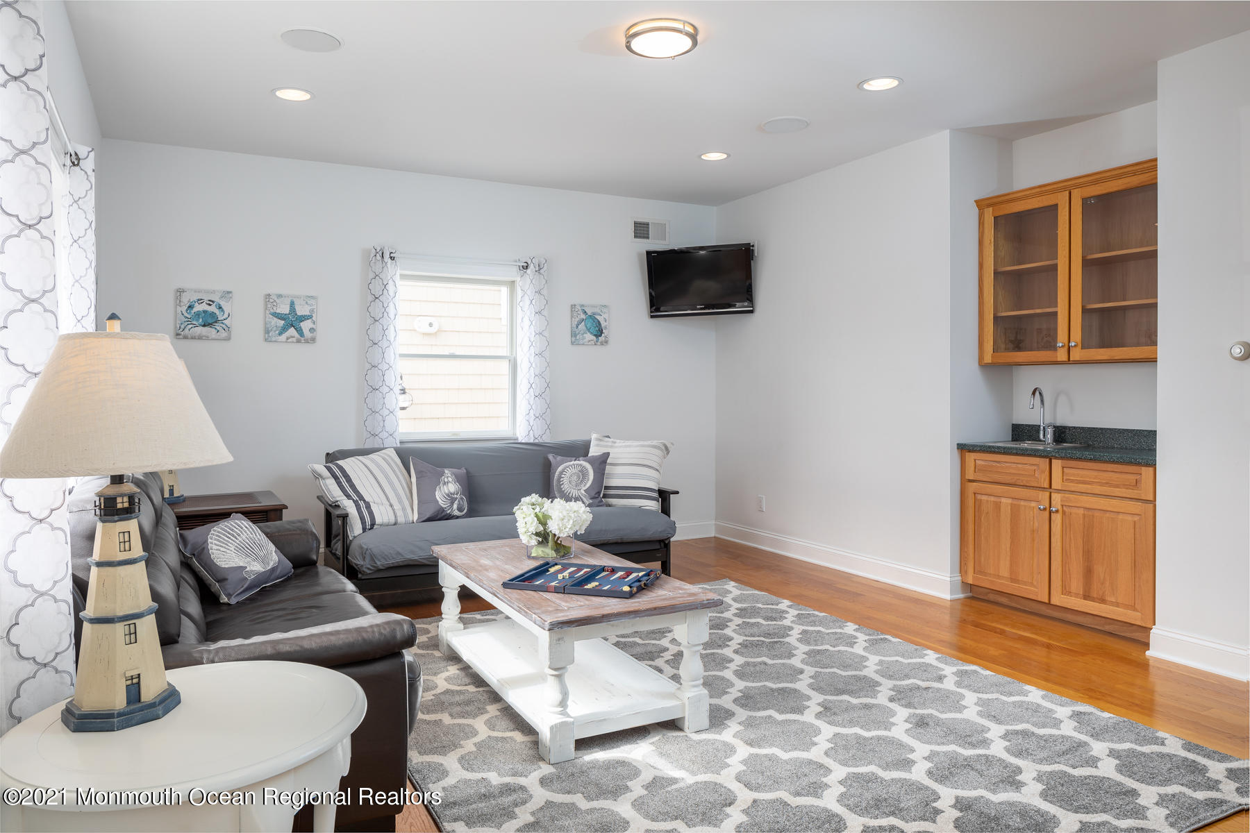 304 Cutter Lane Mantoloking, NJ 08738 - Photo 21 of 54 a living room with furniture and a window